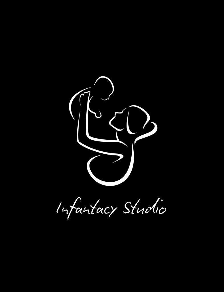 Professional photographer at Infantacy Studio holding camera with warm smile