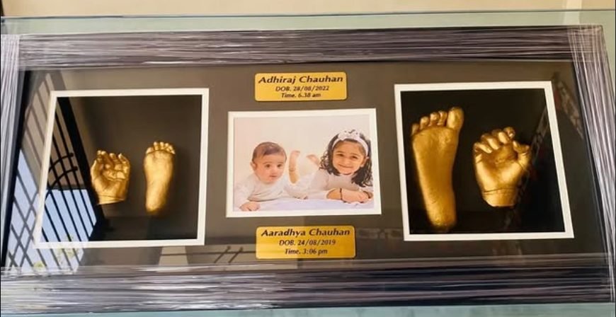 Sibling hand and foot casts with family photo keepsake